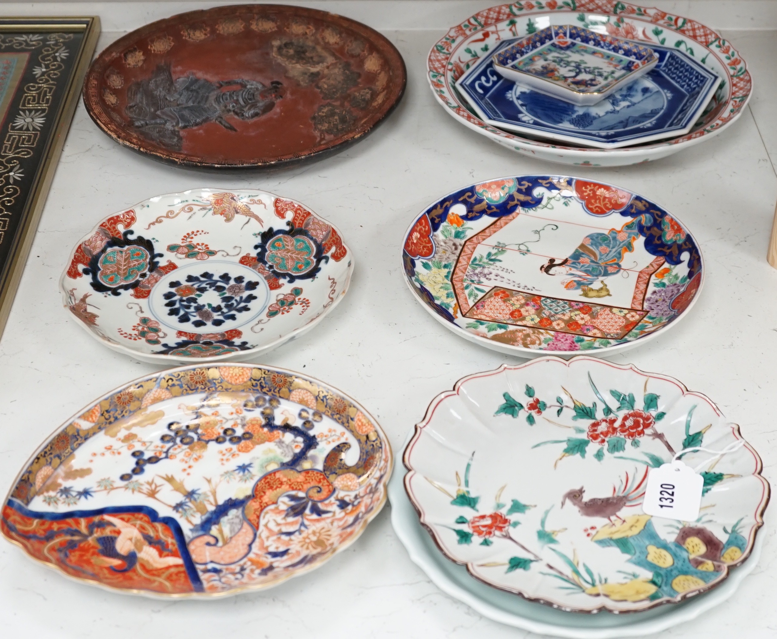 A group of 19th/20th century Japanese porcelain and pottery dishes. Largest 33cm diameter